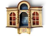 a wooden cabinet with a glass door and a window