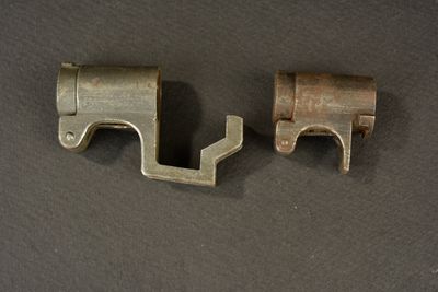 two pieces of metal are shown on a black surface
