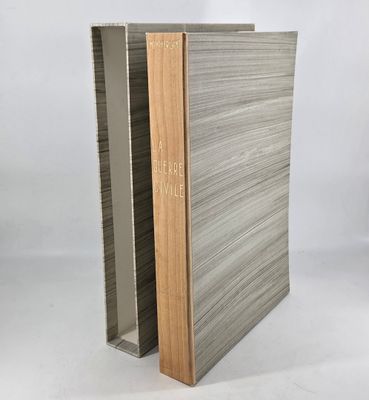 a book with a wooden cover sitting on top of a table