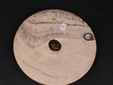 an image of a plate with a penny on it