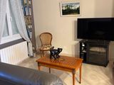 a living room with a couch and a television in it