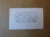 an envelope with a handwritten message on it sitting on top of a table