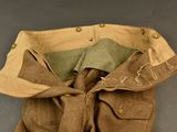 a brown and tan jacket with a tie on it