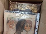 a cardboard box with a picture of a man and a cat inside of it