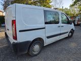 a white van that is parked in the parking lot