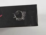 a picture of a black box with a red flower on it