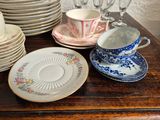 a lot of plates and cups on a table