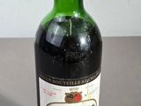 a bottle of wine that is sitting on a table
