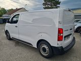 a white van that is parked in a parking lot