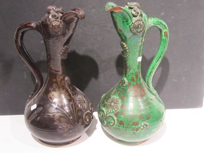 two vases sitting side by side on a table