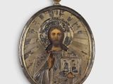 une image représentant Jésus sur une médaille en or