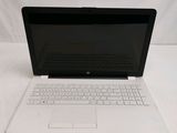 an open laptop computer sitting on top of a white table