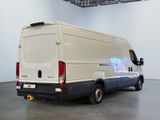 a white van that is parked in a large room