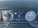 the dashboard of a car with a digital display showing the speed of the car