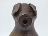 a brown dog shaped vase with a hole in it ' s mouth