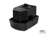 a close up of a black battery charger on a white background