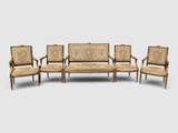un ensemble composé de quatre chaises et d'une table de style Louis II