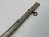 an old metal pipe with a metal ring on it