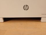 a white printer sitting on top of a wooden table