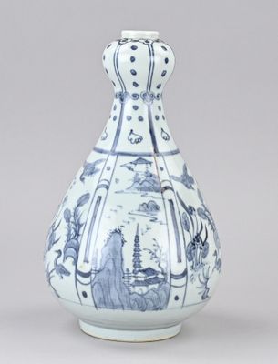 un vase bleu et blanc orné d'un paysage