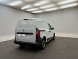 the back end of a white van parked in a white room