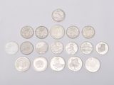 an image of a pile of coins sitting on top of a white surface