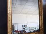 a mirror that is sitting on a black surface