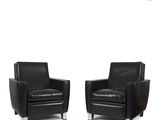 pair of black leather club chairs with chrome legs