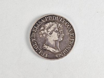 une vieille pièce d'argent avec un visage de femme dessus