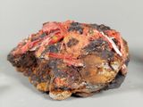 a piece of rock that has been burnt and is sitting on a table