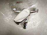 a silver object that is laying on a plastic bag