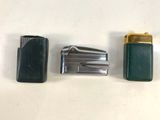 two lighters and a lighter case on a table