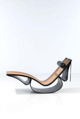 an image of a black and white chair on a white surface