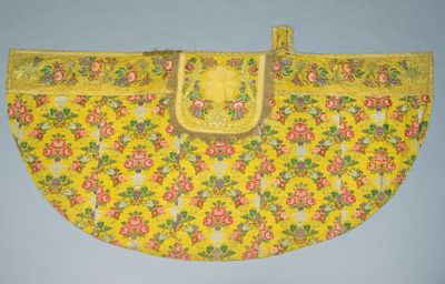a close up of a yellow purse with flowers on it