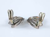 two tone gold and diamond earrings on a white background