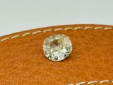 an image of a diamond sits on top of a brown leather case