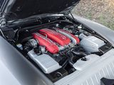 a silver car with a red engine in the trunk