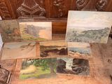 four paintings on a wooden table with a wooden bench in the background