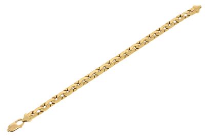 a gold bracelet with a heart design on it