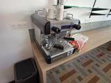 a coffee machine that is sitting on a wooden table