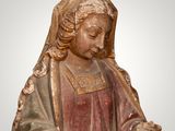 an image of a statue of a woman holding a piece of paper