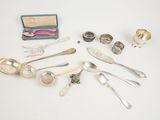 several silverware items including spoons, spoons, and other items