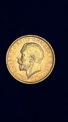 a close up of a coin on a black surface