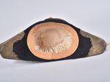a black hat with a gold trim and a white background