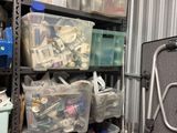 many plastic bins on the shelves in the room
