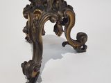 an antique brass table with a marble top on a white background