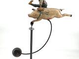 statue of a man riding a horse with a dog on it