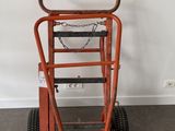 a small hand truck that is sitting in a room