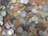 a lot of coins that are on the table