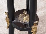 a black table with a gold decoration on top of it